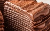 a slice of chocolate crepe cake